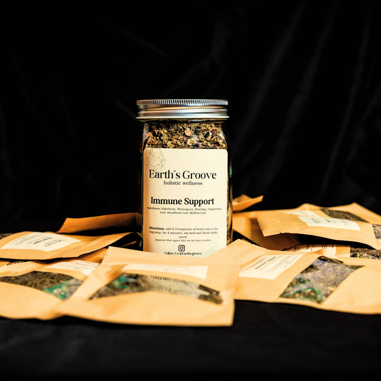 Jar of Earth's Groove Immune Support supplement with packaging on a black background
